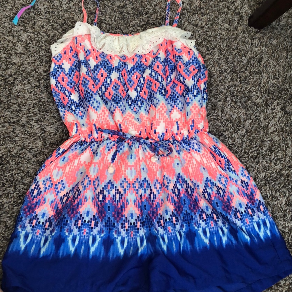 Pink and blue romper with lace detail on front
